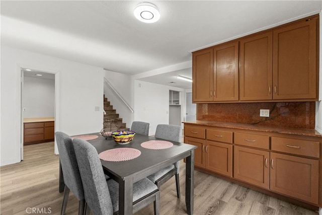 dining space featuring light hardwood / wood-style floors