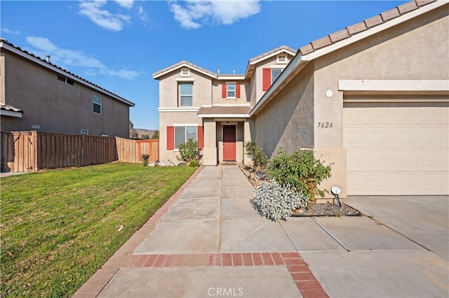 traditional-style house with an attached garage, a front yard, fence, and stucco siding