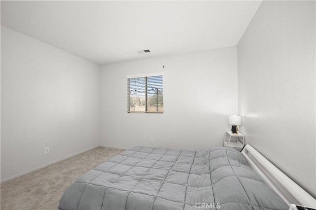 unfurnished bedroom featuring light carpet