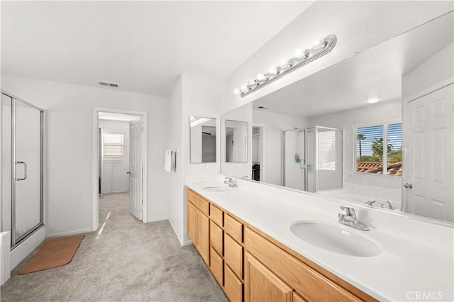 bathroom featuring a healthy amount of sunlight, visible vents, and a sink