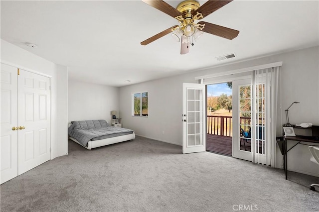 bedroom with visible vents, access to exterior, carpet flooring, french doors, and multiple windows