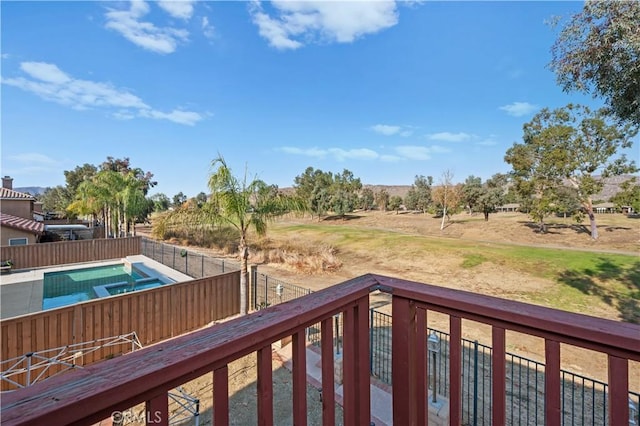 view of yard featuring a fenced in pool and fence