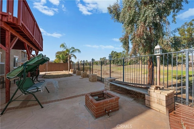 view of patio featuring a fire pit