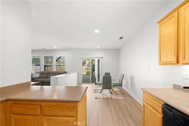 kitchen with recessed lighting, visible vents, light wood-style flooring, open floor plan, and dishwasher