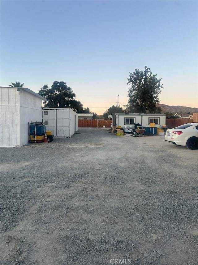 view of parking at dusk