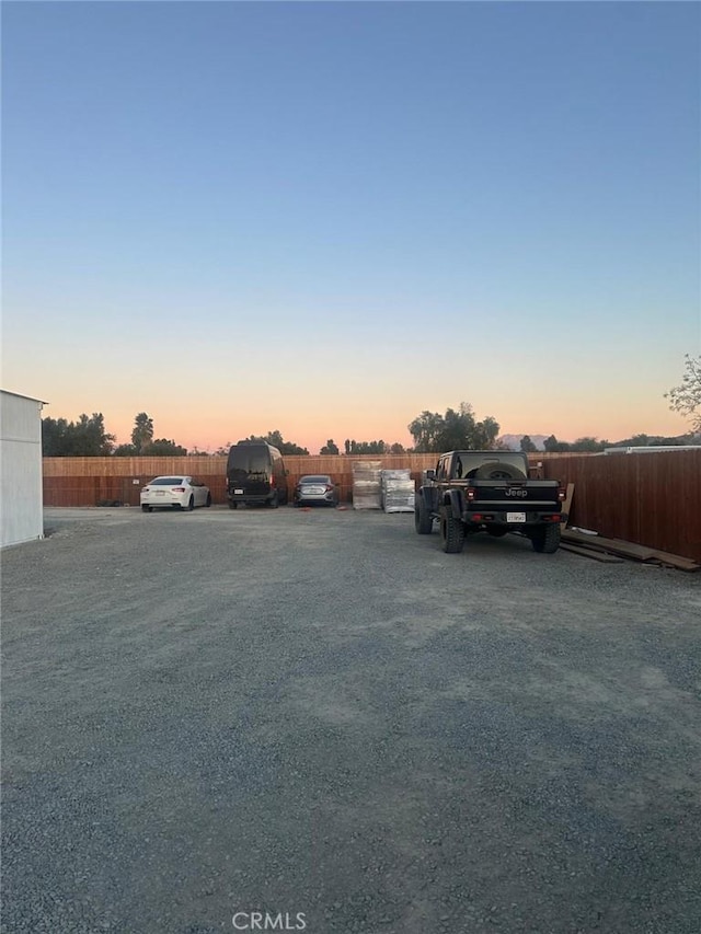 view of parking at dusk