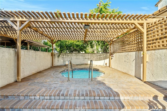 view of pool with an in ground hot tub