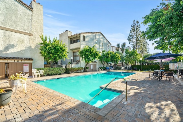 view of pool featuring a patio area