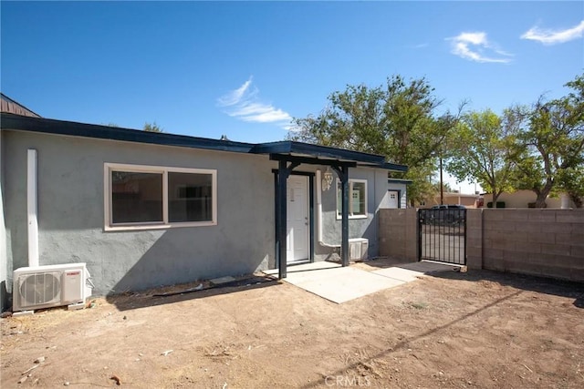 exterior space featuring ac unit