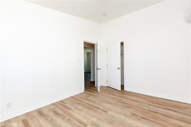 unfurnished room with light hardwood / wood-style floors