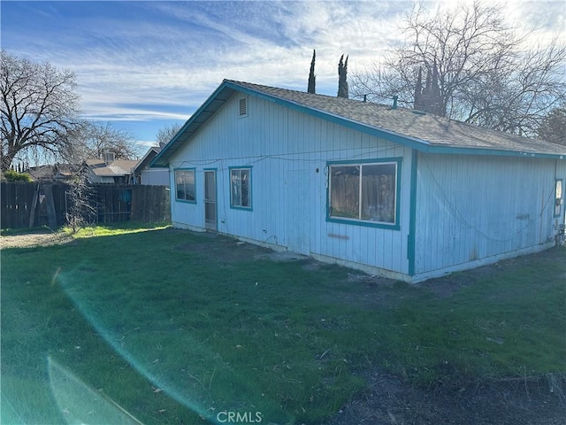 view of side of property featuring a yard