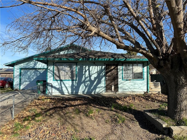 ranch-style house featuring a garage