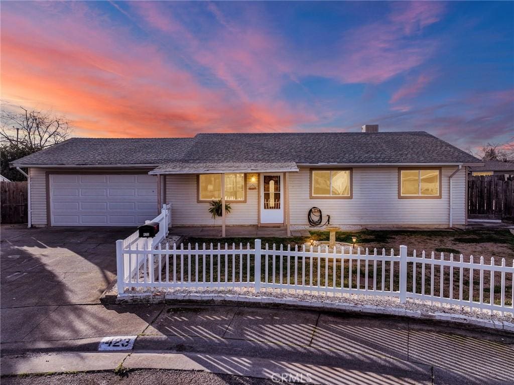 ranch-style home featuring a garage