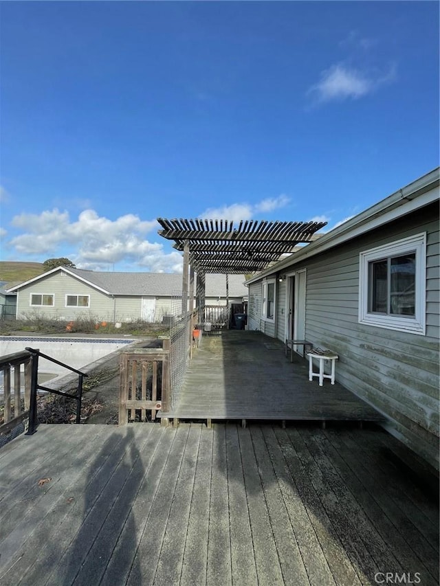 wooden terrace with a pergola