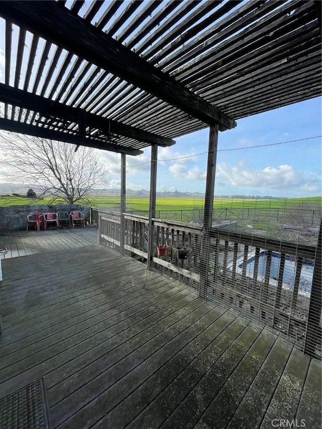 wooden terrace with a rural view