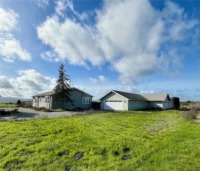 view of home's exterior featuring a yard