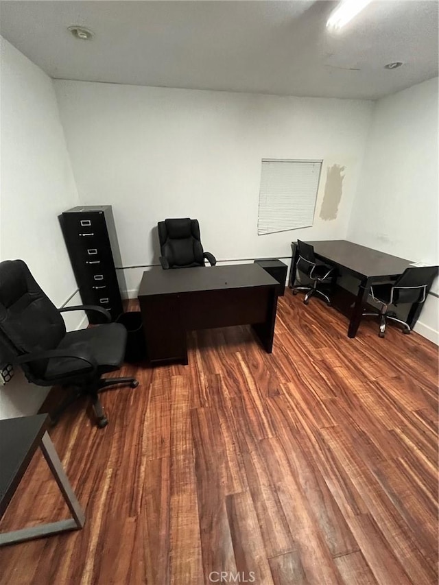 home office with wood-type flooring