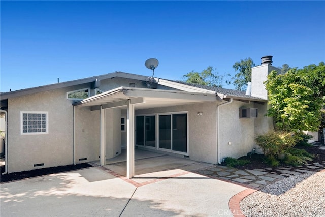 rear view of house with a patio