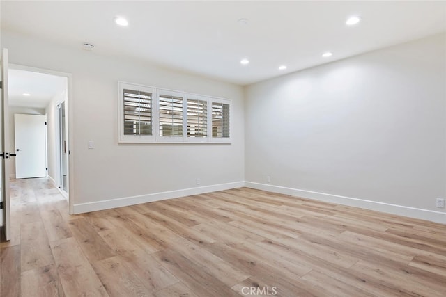 unfurnished room featuring light hardwood / wood-style flooring