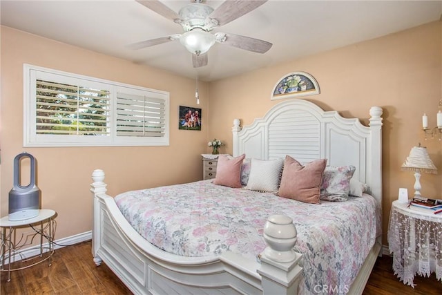 bedroom featuring ceiling fan and dark hardwood / wood-style floors