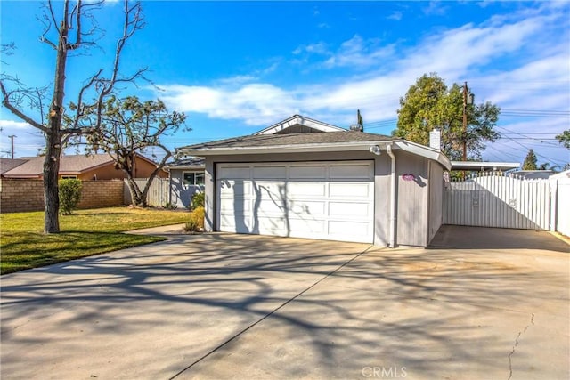 garage featuring a yard