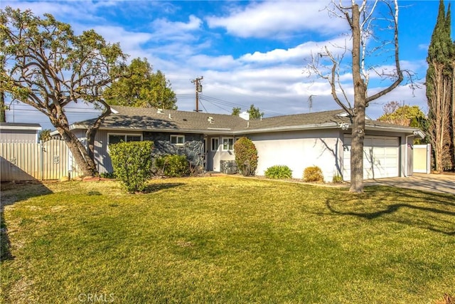 single story home featuring a garage and a front lawn