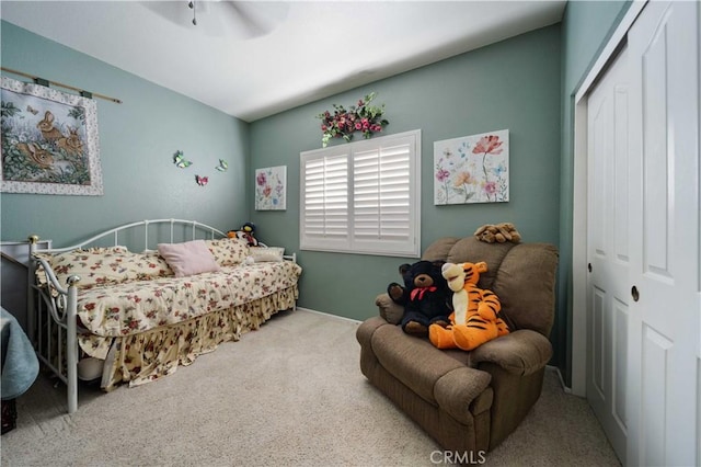 bedroom featuring carpet flooring, a closet, and ceiling fan