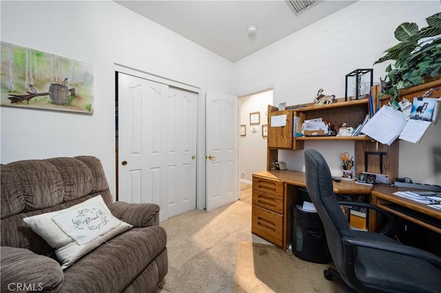 office area featuring light carpet