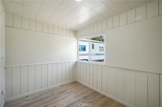 spare room with light hardwood / wood-style floors