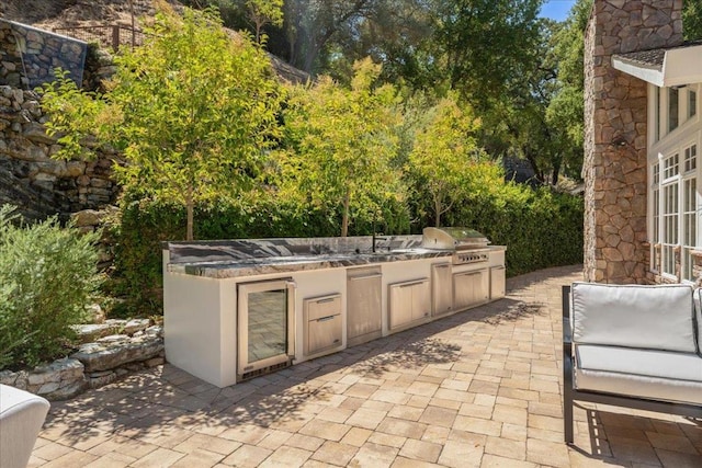 view of patio with grilling area and exterior kitchen