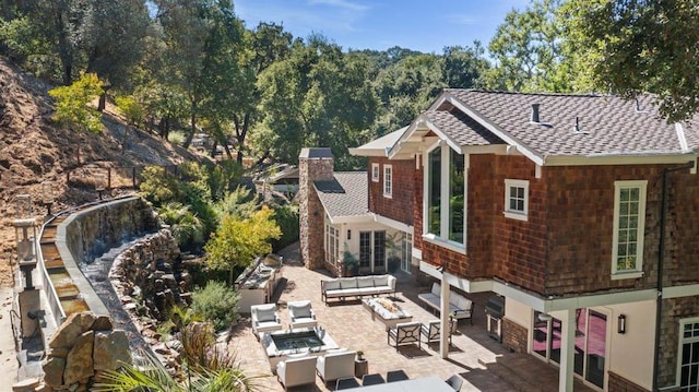 back of house with a patio and an outdoor hangout area