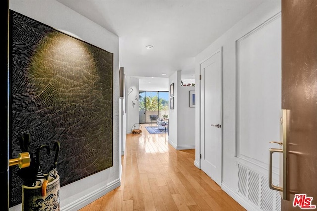 hallway featuring light wood-type flooring