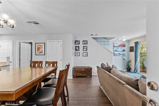 dining space with a notable chandelier