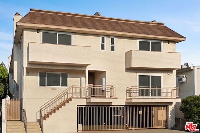 view of front facade with a balcony