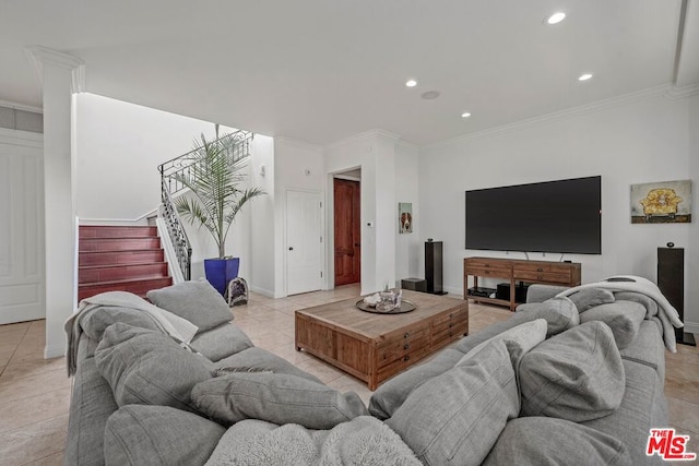 living room featuring light tile patterned floors and crown molding