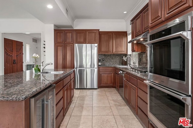 kitchen featuring stainless steel appliances, wine cooler, backsplash, dark stone countertops, and ornamental molding