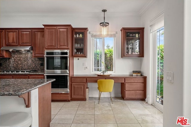 kitchen featuring decorative backsplash, light tile patterned floors, double oven, and ornamental molding