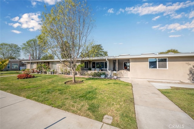 ranch-style home with a front yard