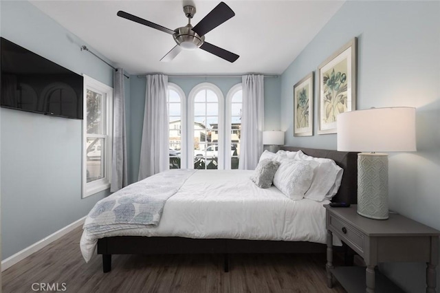 bedroom featuring ceiling fan and dark hardwood / wood-style floors