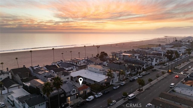 aerial view at dusk with a water view