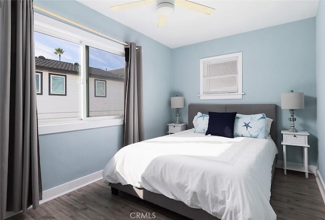 bedroom with ceiling fan and dark wood-type flooring