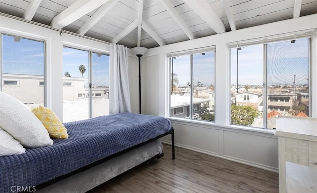 bedroom with vaulted ceiling with beams, wooden ceiling, and dark wood-type flooring