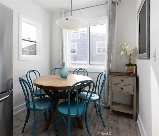 dining room with hardwood / wood-style floors