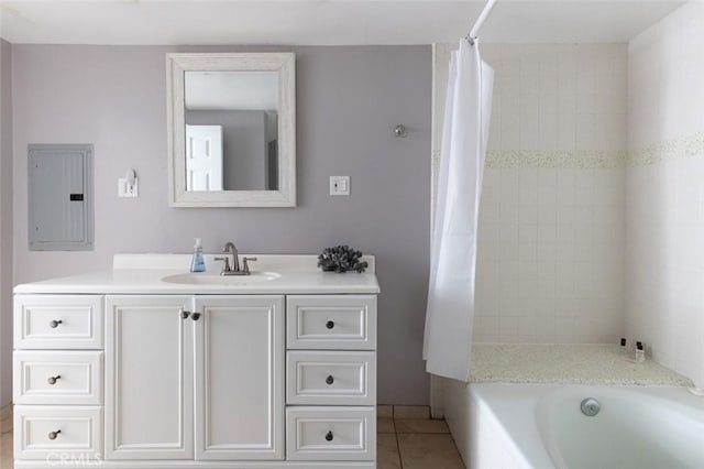 bathroom featuring electric panel, tile patterned flooring, and vanity