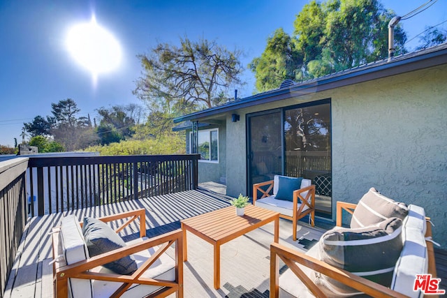 deck with an outdoor living space