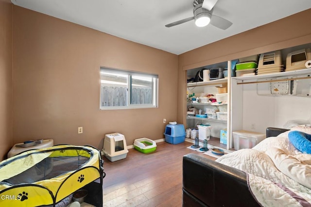 bedroom featuring wood-type flooring and ceiling fan