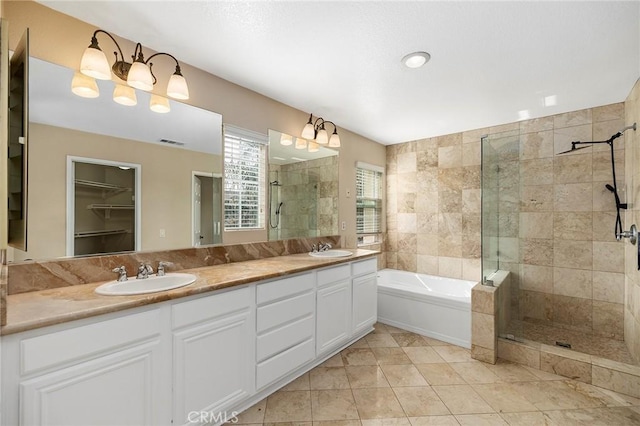 bathroom featuring vanity, tile patterned floors, and shower with separate bathtub