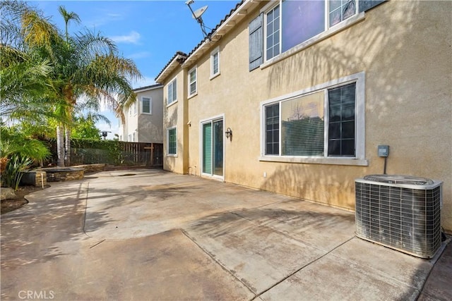 back of property featuring a patio area and central air condition unit