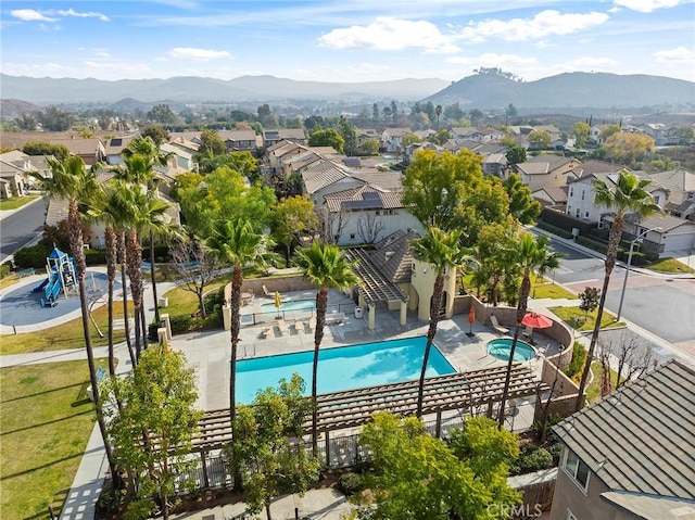 view of pool with a mountain view and a patio area