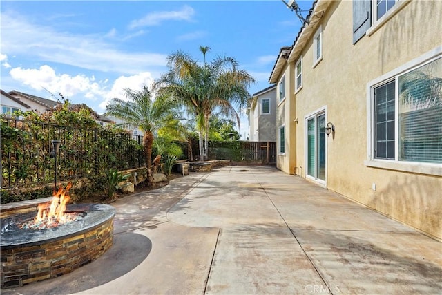 view of patio / terrace with an outdoor fire pit